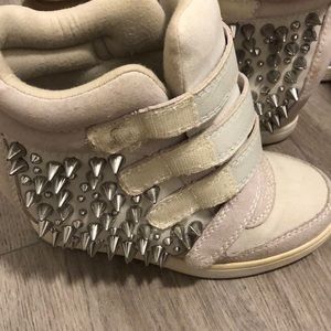 Spiked and wedge sneakers